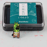SUPA LUNA Enamel Pin Cat hiding behind monstera